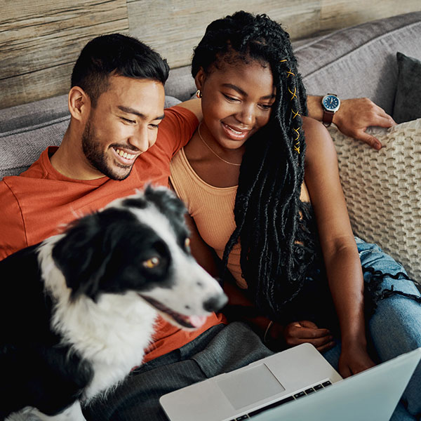 young couple sitting with their Border Collie